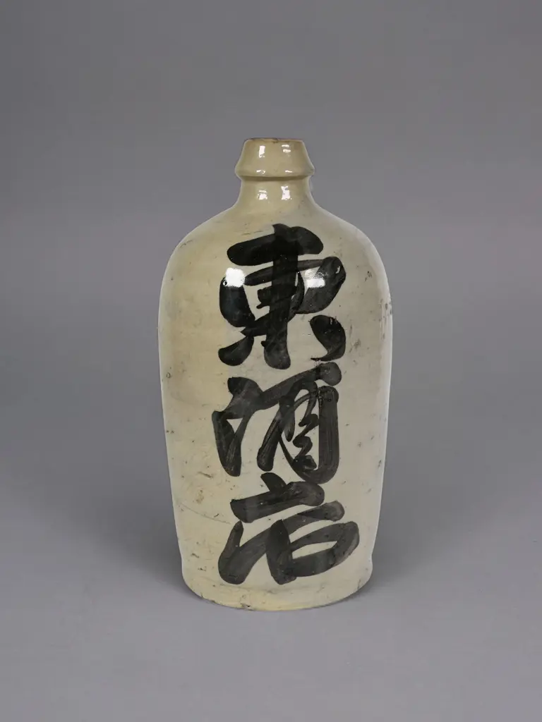 A Japanese stoneware sake bottle, Image 1++